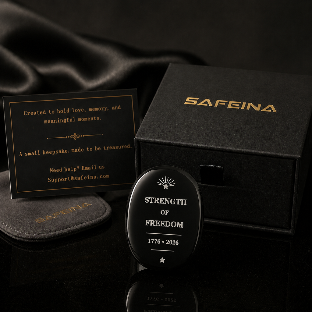Black obsidian crystal keepsake with laser engraved Strength of Freedom 1776–2026 design – front view, SAFEINA