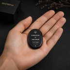 Close-up of laser engraved Strength of Freedom design on black obsidian crystal keepsake – SAFEINA
