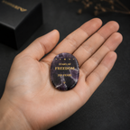 Close-up of laser engraved Stars of Freedom design on natural amethyst crystal keepsake – SAFEINA